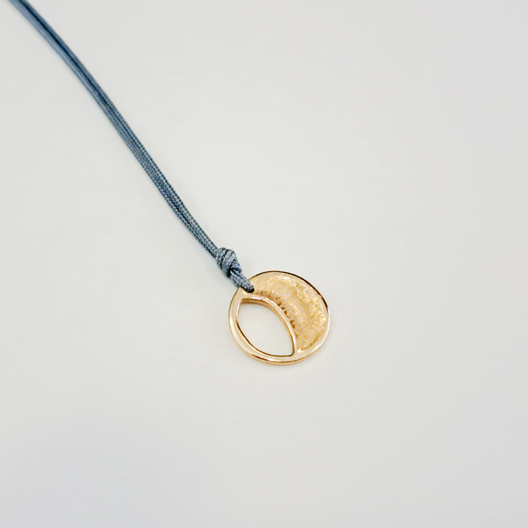 Origins V pendant on thread