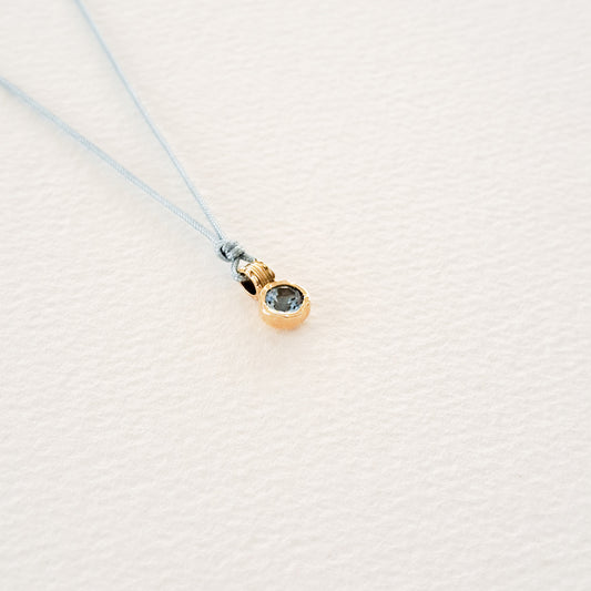Water/Blue Topaz pendant on thread
