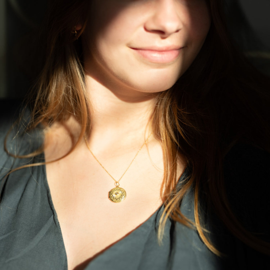 Cosmic Eye locket with a diamond