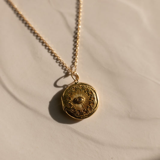 Cosmic Eye locket with a diamond