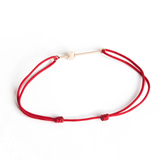 Pearl bracelet on thread