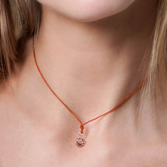 Creativity pendant on thread