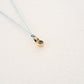 Water/Blue Topaz pendant on thread