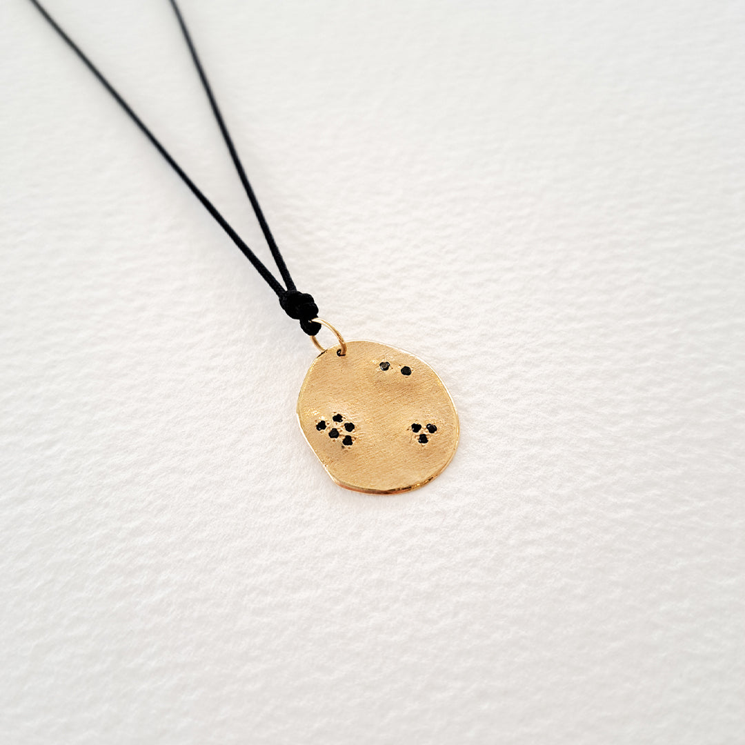 Origins IV pendant on thread