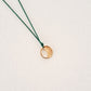 Origins V pendant on thread