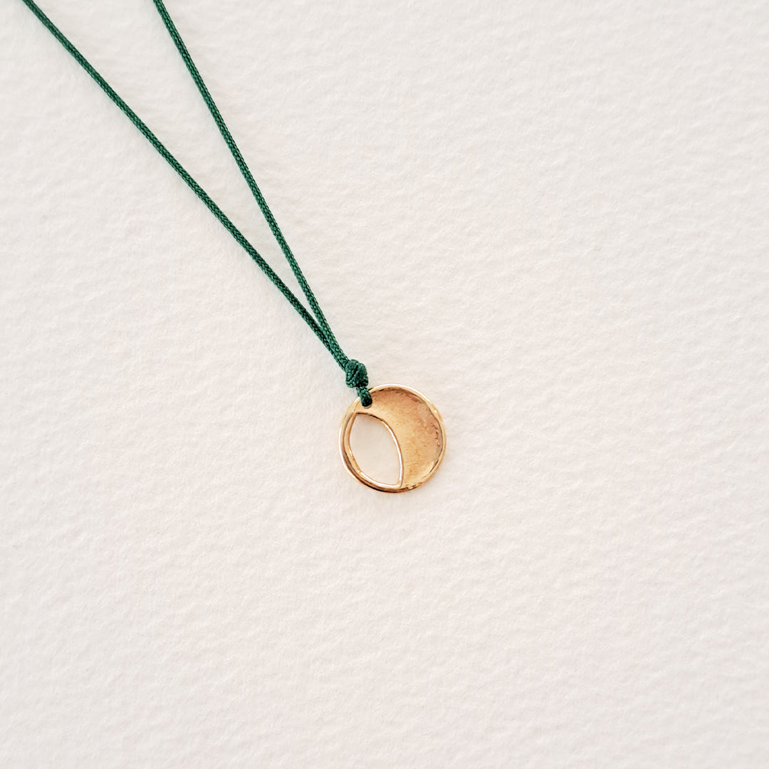 Origins V pendant on thread
