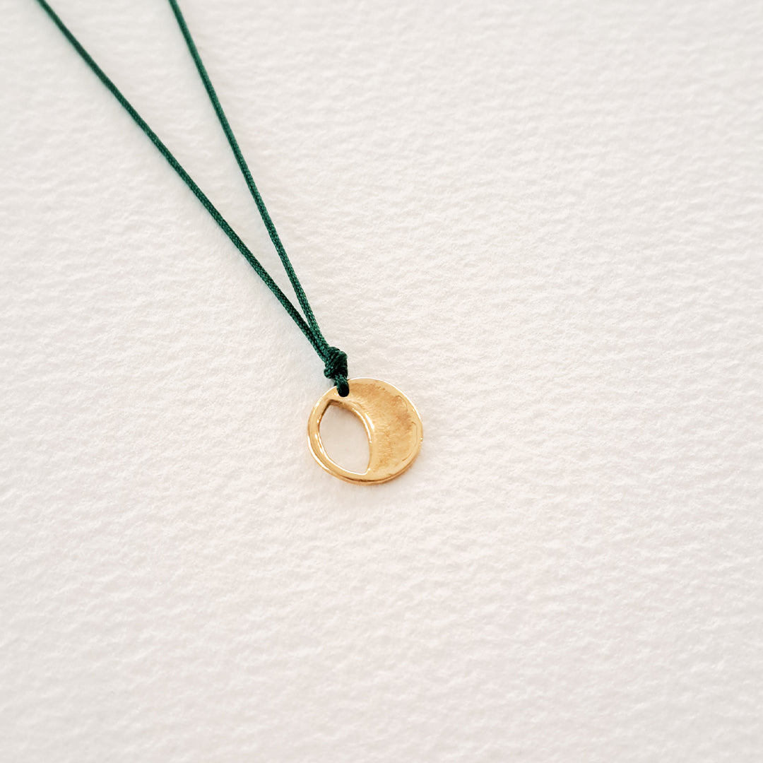 Origins V pendant on thread