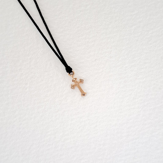 Cross pendant on thread