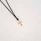 Cross pendant on thread
