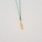 Feather pendant on thread