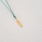 Feather pendant on thread
