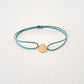 Om bracelet on thread
