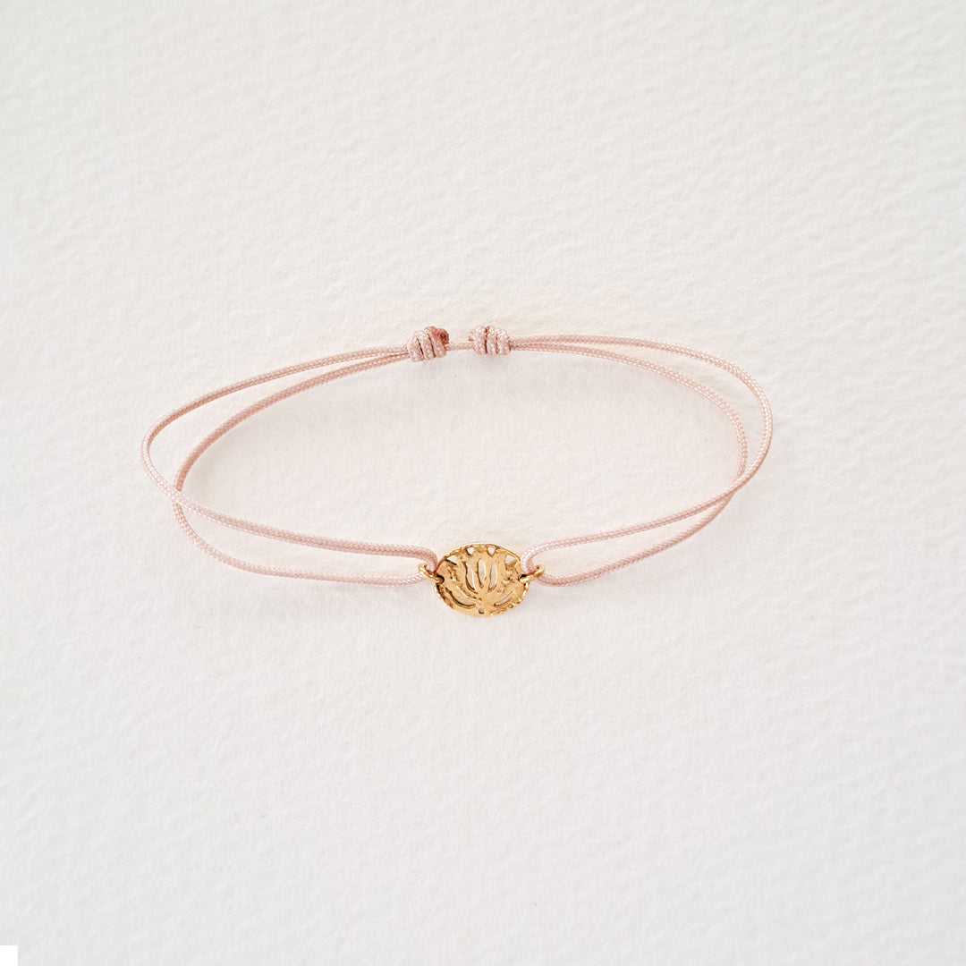 Lotus bracelet on thread