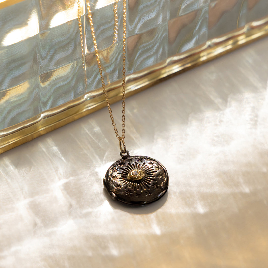 Black Cosmic Eye locket with a diamond