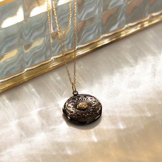 Black Cosmic Eye locket with a diamond