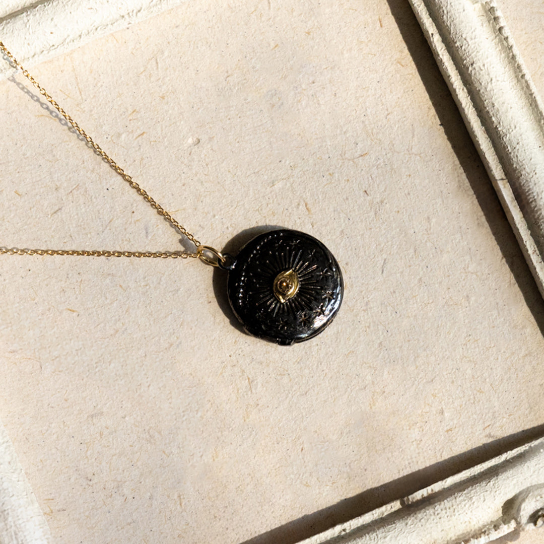 Black Cosmic Eye locket with a diamond