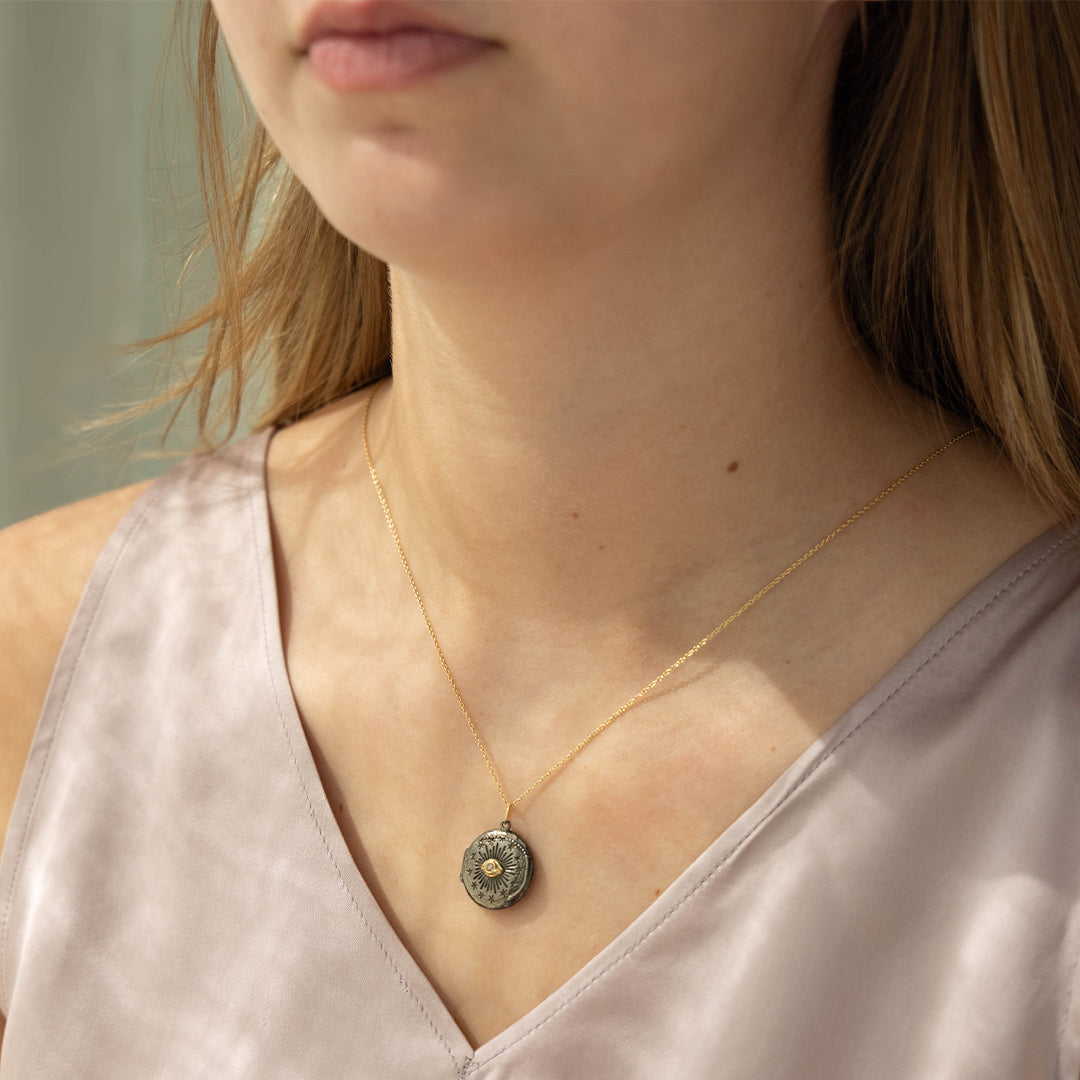 Black Cosmic Eye locket with a diamond