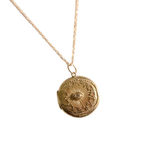 Cosmic Eye locket with a diamond